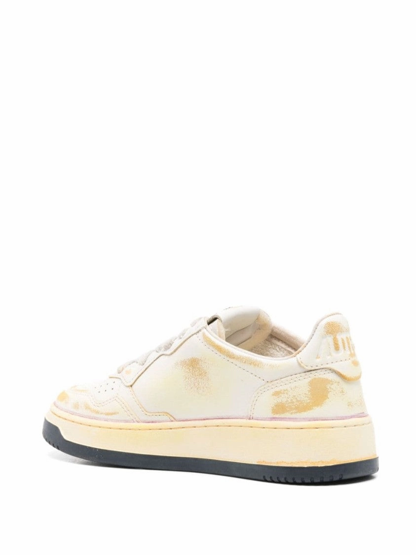 Low-Top Sneakers With Distressed Finish And Perforated Detailing